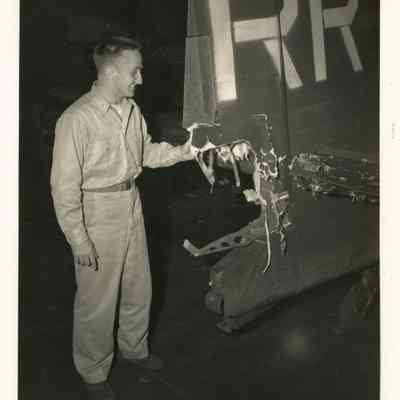 Pilot Looking at Battle Damage