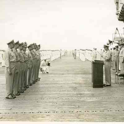 Captain Arnold McKechnie Reading his Final Orders at the Changing of Command Ceremony