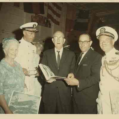 Arthur Beaumont Presents one of his Paintings to Captain Cain and The USS Yorktown