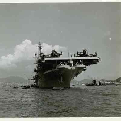 USS Yorktown (CVA-10) anchored just offshore.