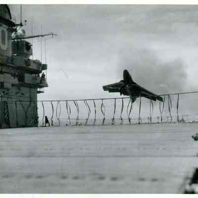 A F9F Cougar barrels towards the net barrier after seemingly "bolting" (going above) the arresting wire.