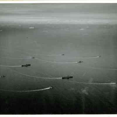The USS Yorktown (CVA-10) practicing maneuvers with the ships of her taskforce.
