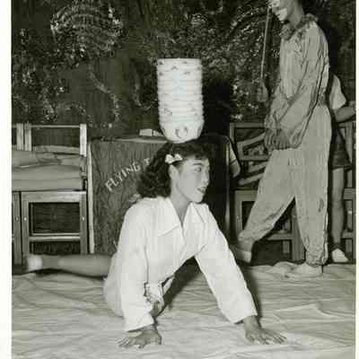 The Flying Tiger Troupe balances bowls aboard the USS Yorktown (CVA-10).