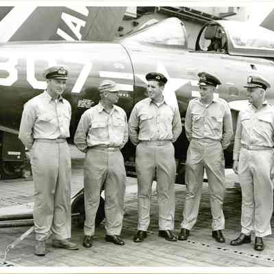 Captain McKechnie on the flight deck with American and British officers.