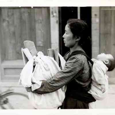 Mother Carrying Wood and Baby