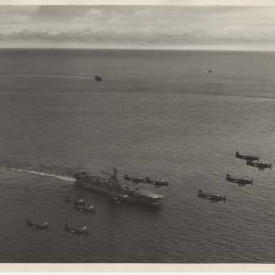Skyraiders Flyover the USS Yorktown (CVA-10)