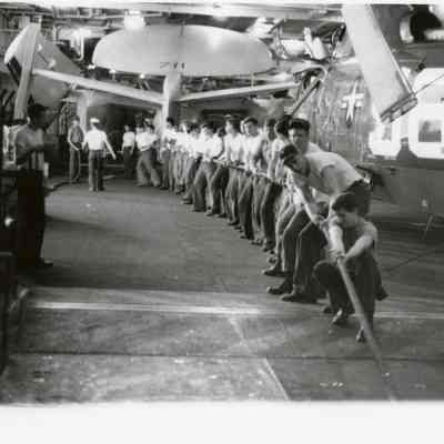 Crewmembers Working in the Hanger Deck