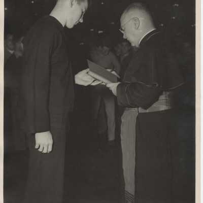 Cardinal Francis Spellman Autographing a Copy of his Book for a Sailor