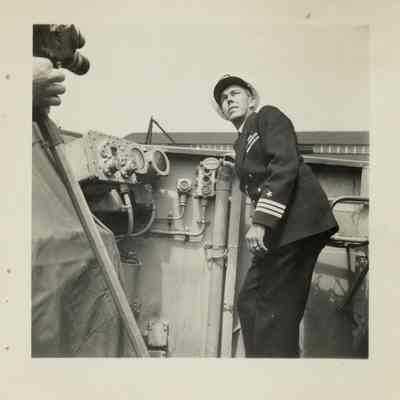 Captain Frederick Becton reviews the damage sustained by the USS Laffey.
