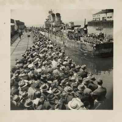 Crowds await their turn to view the ship that would not die.