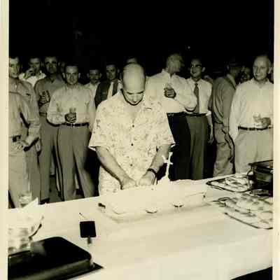 Captain Arnold McKechnie Cutting His Farewell Cake