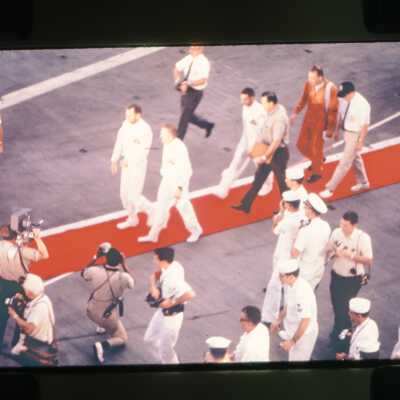 Apollo 8 Astronauts Walk Across the Flightdeck