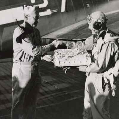 Captain Joseph "Jocko" Clark Congratulates Elisha "Smokey" Stover on his 7,000th Landing