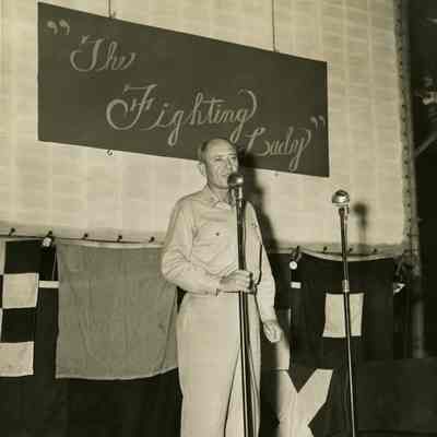 Captain Thomas Combs Speaking on Stage