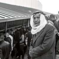 Palestinian Man Waiting at a Checkpoint (2018)