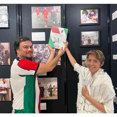 Presentation of book and jersey to Julia Pitner on July 14, 2023.