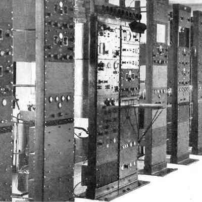 Detail from a Hallicrafters ad. Banks of SP-110s at an unspecified news organizartion.: Image: Radio magazine, Jan 1942