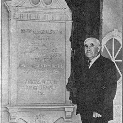 ARRL president Eugene Woodruff, W8CMP, with memorial placard at W1AW, at dedication on Sep 2, 1938.: Image: QST, Oct 1938