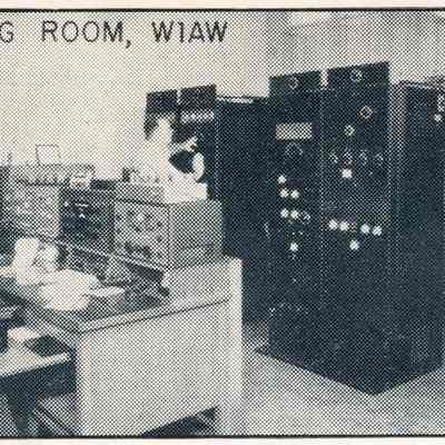 W1AW Maxim Memorial Station, cr. 1960. Equipment in use includes (on the desk, from left), Barker & Williamson 5100 transmitter, Barker & Williamson 51SB sideband adapter, Collins 75A-4 receiver, and Hammarlund HQ-140 receiver.: Image was isolated from a W1AW QSL card postmarked January, 1964. Part of a postmark is visible at right.