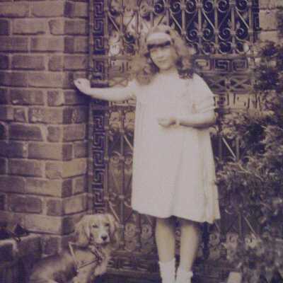 Girl leaning against gate