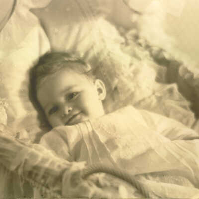 Portrait of infant in bassinet