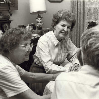 Virginia Fiester Frederick meeting with two unidentified people