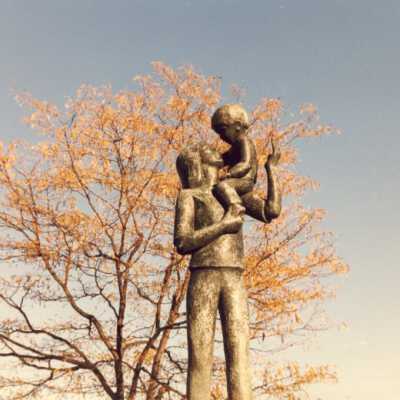 "Girl with Baby on Shoulder" statue