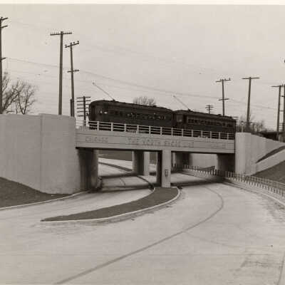 Trolley going over Sheridan Road viaduct