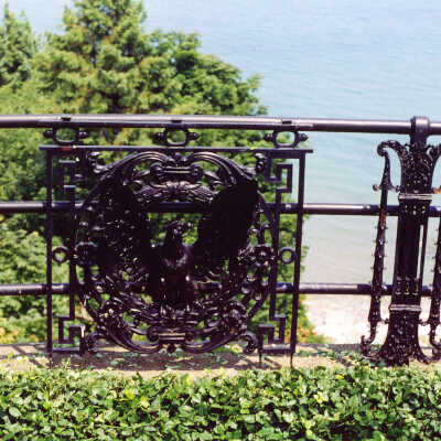 View of fence with eagle decoration at Edward Byron Smith house