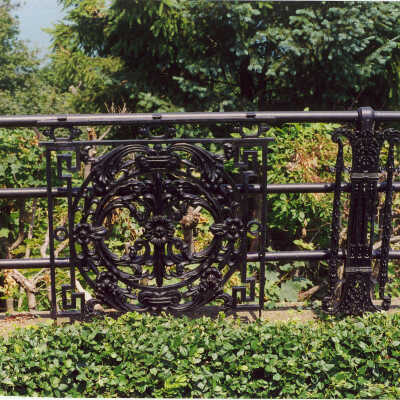 View of fence with circular design at Edward Byron Smith house