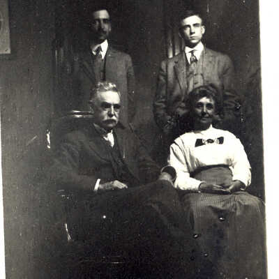 Portrait of three men and a woman