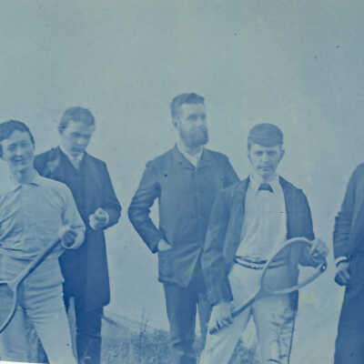 Men with Tennis Rackets