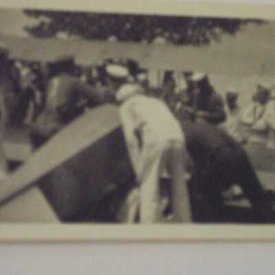 Sailors looking at airplane