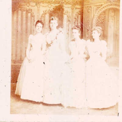 Young women in ballgowns