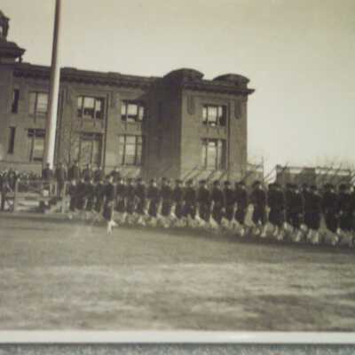 Company marching past review stand