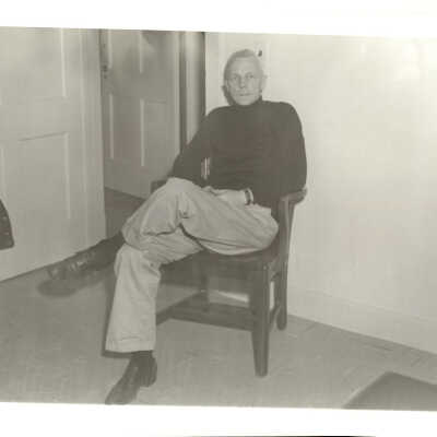 Police staffer (?) in chair