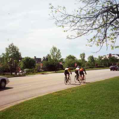 Bikers Passing American Flags
