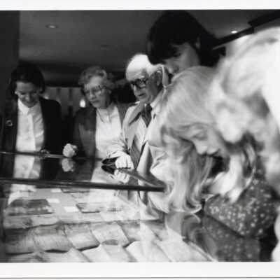 People looking at display cases