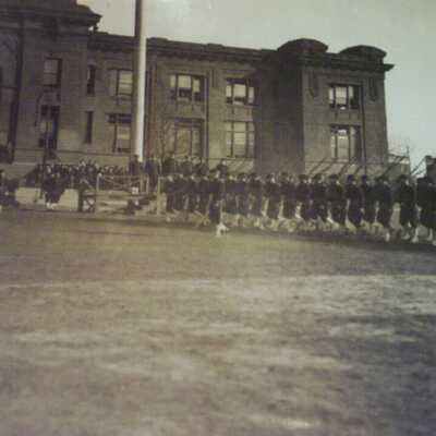 Company marching past review stand