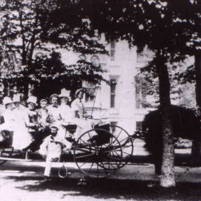 C.B. Farwell group in a buckboard
