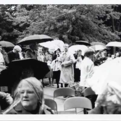 People outside with umbrellas