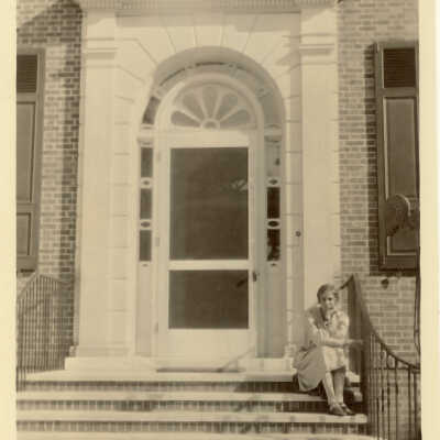 Grace McGann Sitting on Porch