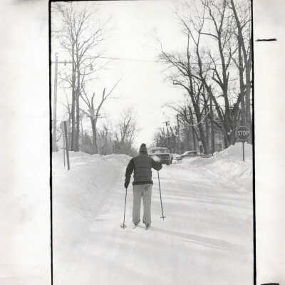 Cross country skier on snowy road