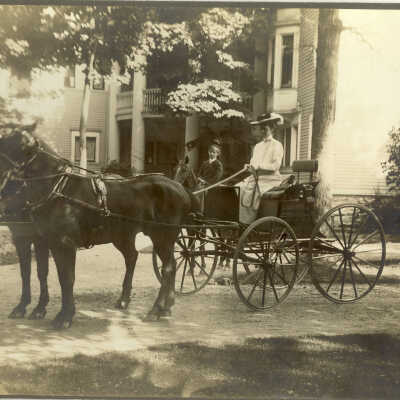 Carriage in front of House in the Woods