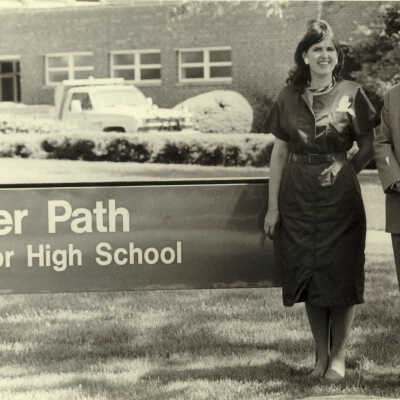 Principal in front of Deerpath Junior High School