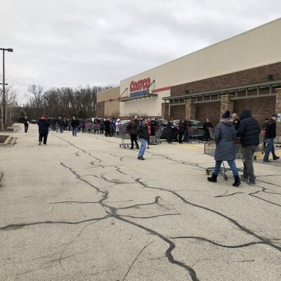 "Lining up to get into Costco - before social distancing"