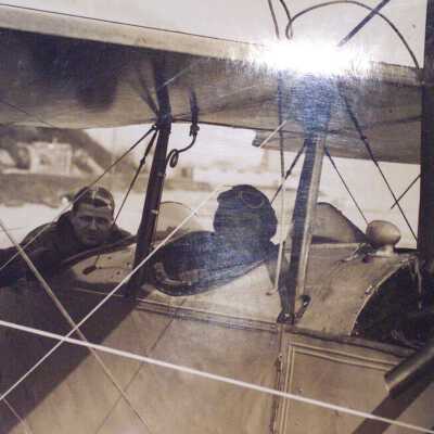 Two aviators and a bi-wing plane