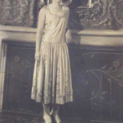 Young woman standing in front of fire place