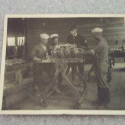 Sailors with mechanical equipment