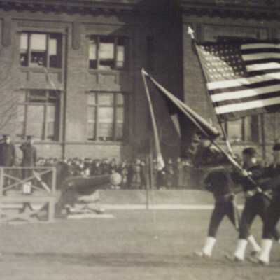 Color Guard marching past review stand